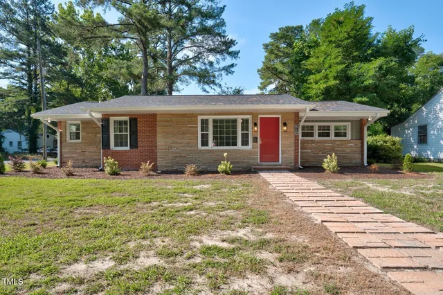 front view of a house with a yard