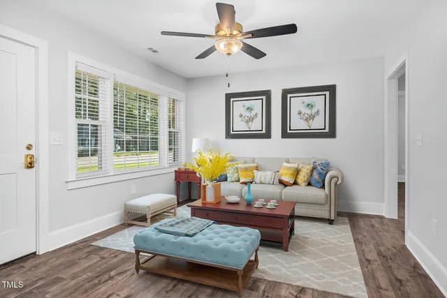 a living room with furniture and a window
