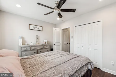a bathroom with a sink toilet and mirror