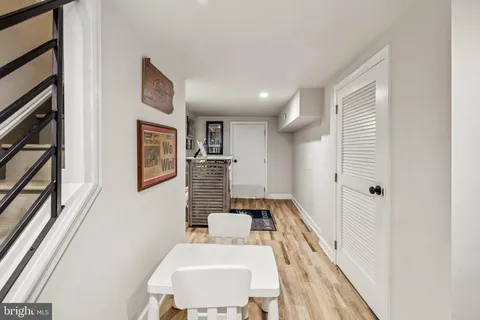 a spacious bathroom with a sink and a mirror