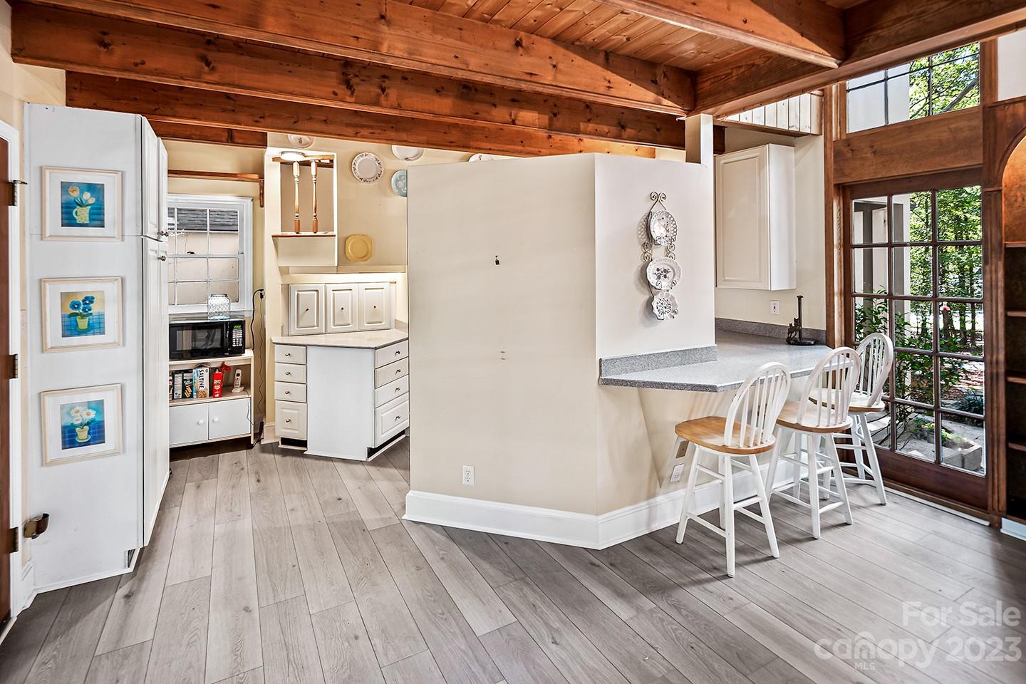255 Thousand Oaks Road Indian Land, SC 29707 - Photo 13 of 37 a view of a kitchen with furniture and wooden floor