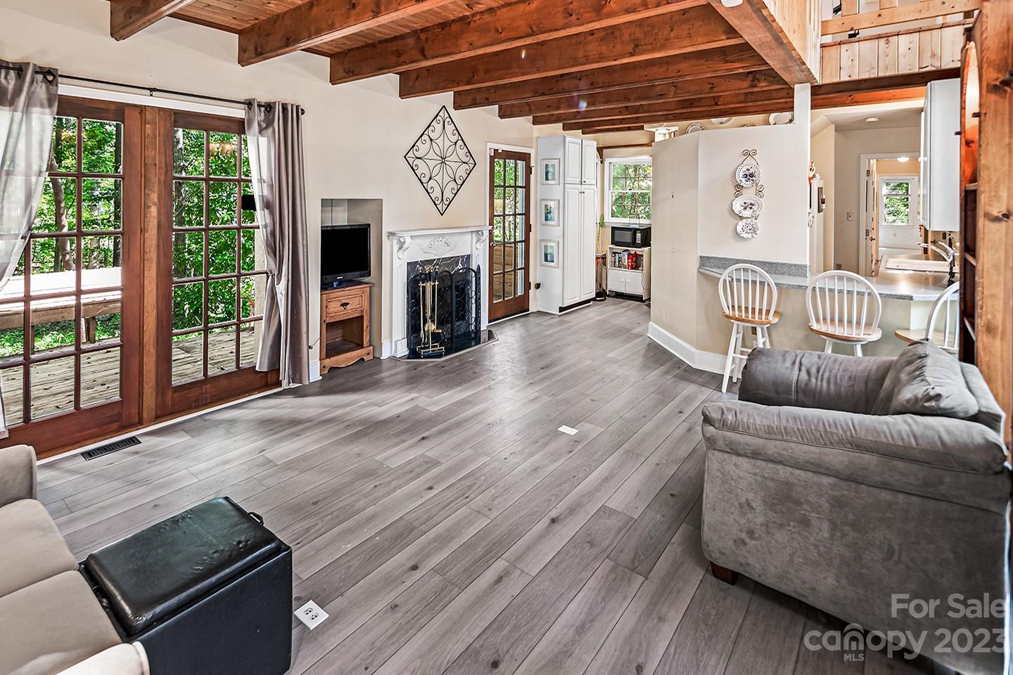 255 Thousand Oaks Road Indian Land, SC 29707 - Photo 14 of 37 a living room with furniture a fireplace and a window