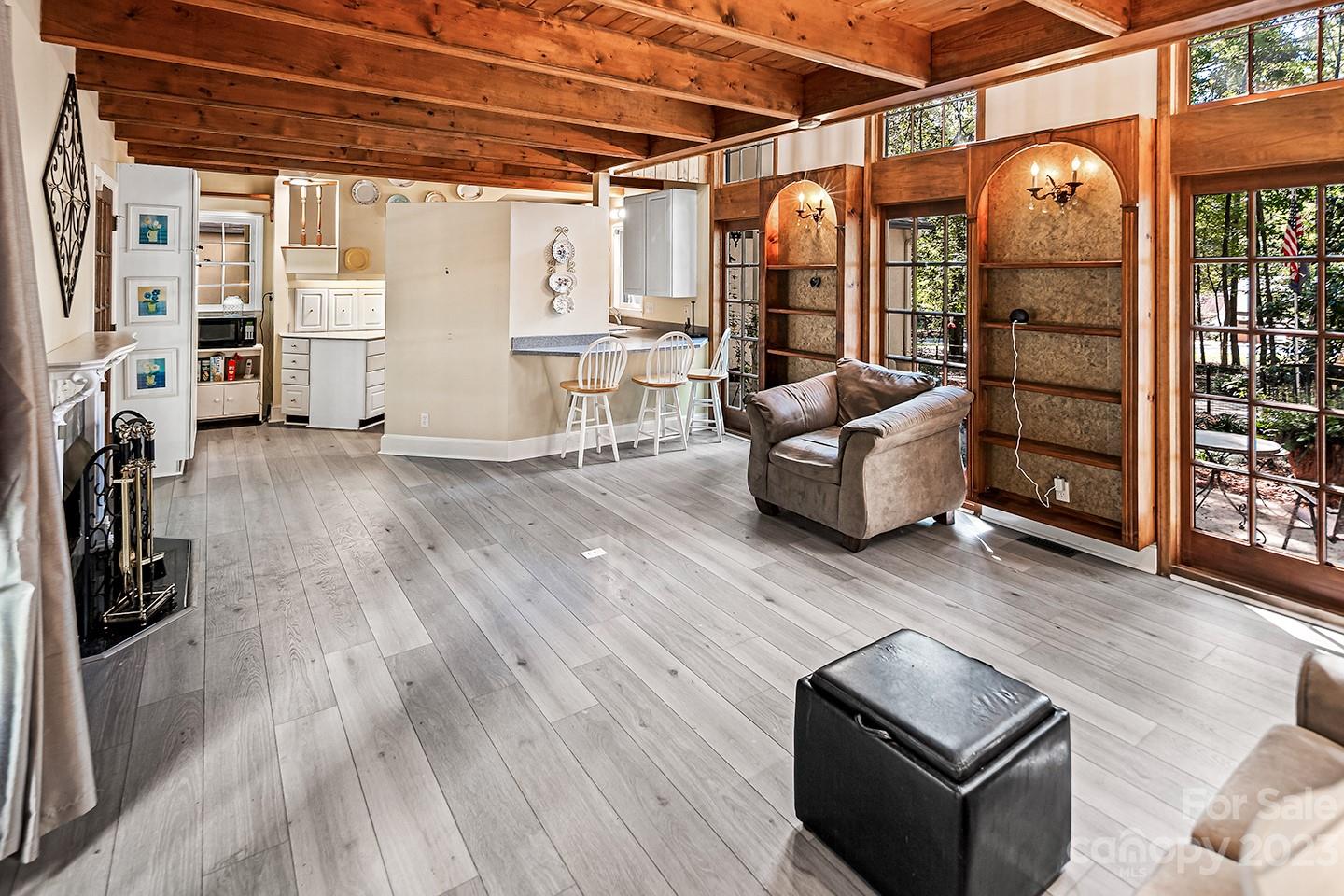 255 Thousand Oaks Road Indian Land, SC 29707 - Photo 15 of 37 a living room with furniture and a floor to ceiling window