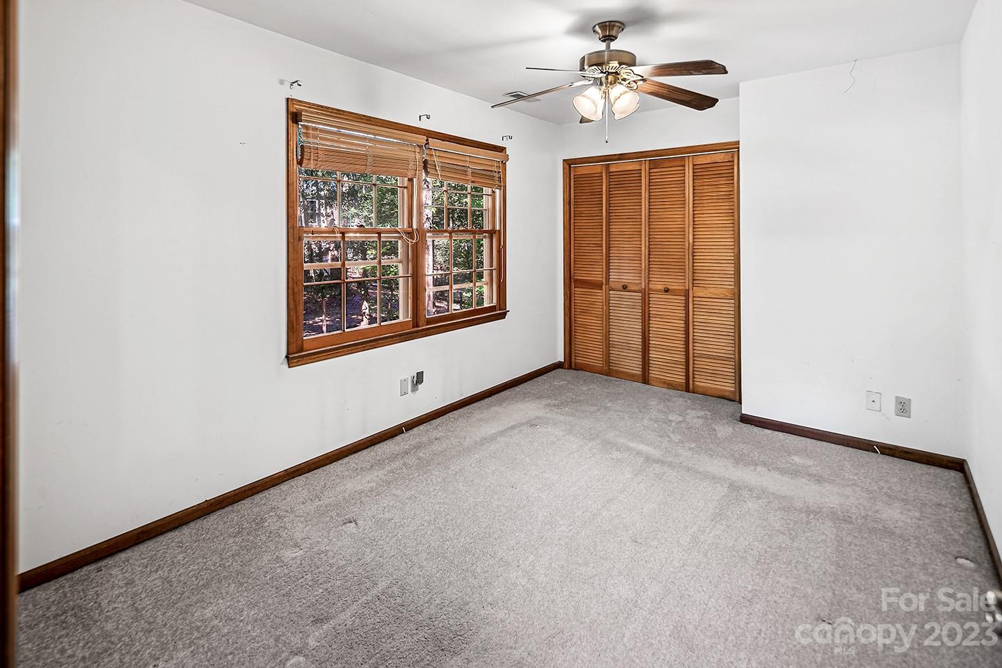 255 Thousand Oaks Road Indian Land, SC 29707 - Photo 29 of 37 an empty room with windows and fan