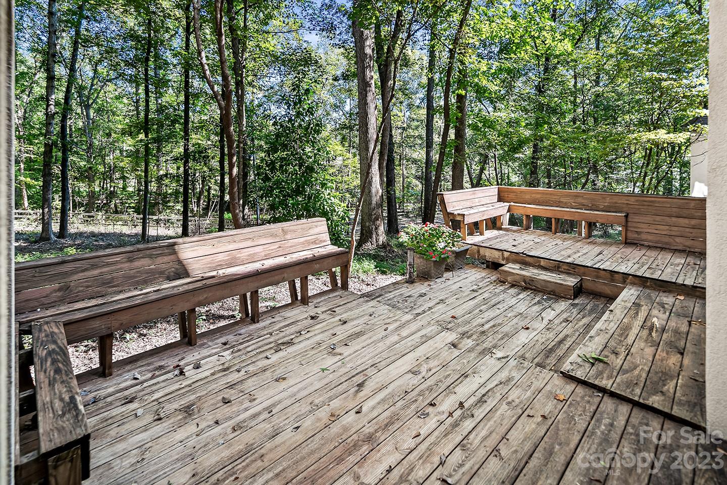 255 Thousand Oaks Road Indian Land, SC 29707 - Photo 32 of 37 a view of a wooden deck with a bench