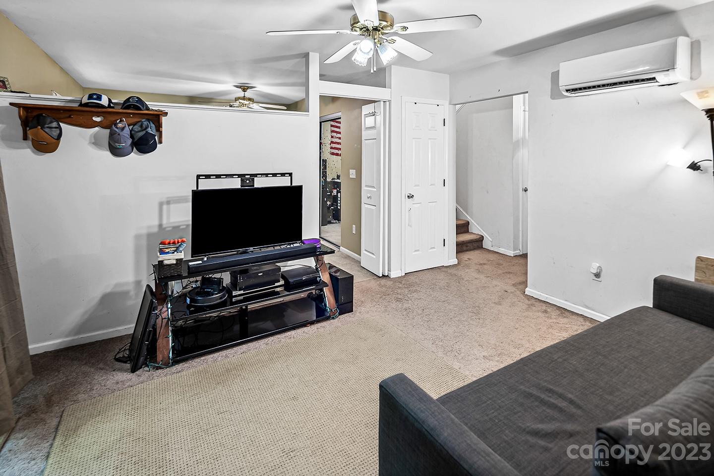 255 Thousand Oaks Road Indian Land, SC 29707 - Photo 35 of 37 a living room with furniture and a flat screen tv