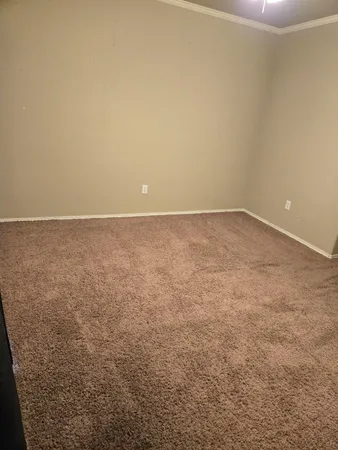 a bathroom with a granite countertop sink and a toilet