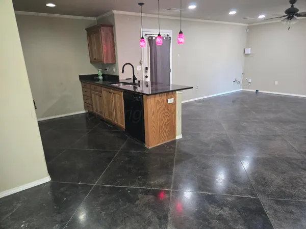 a kitchen with stainless steel appliances granite countertop a sink and a microwave