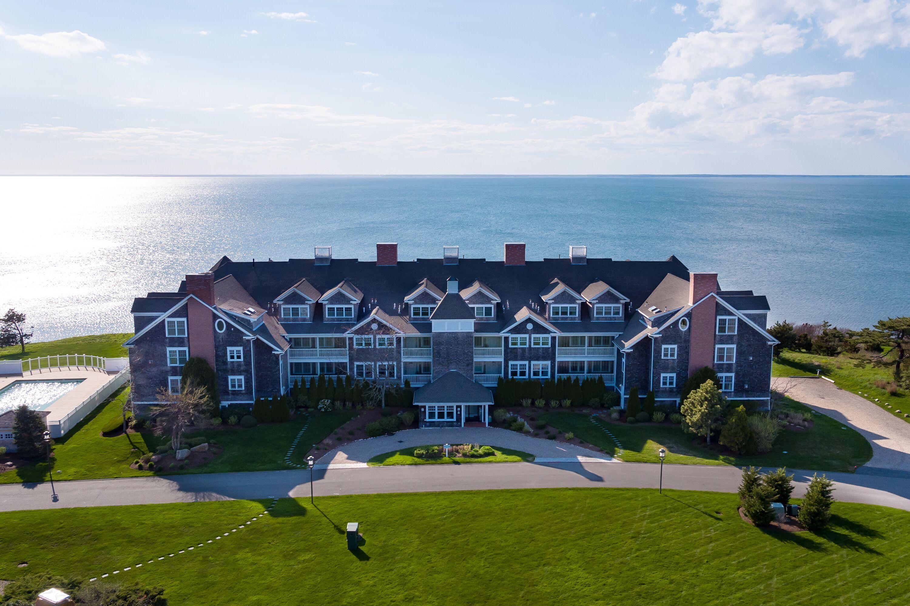 an aerial view of a house with a garden and fire pit