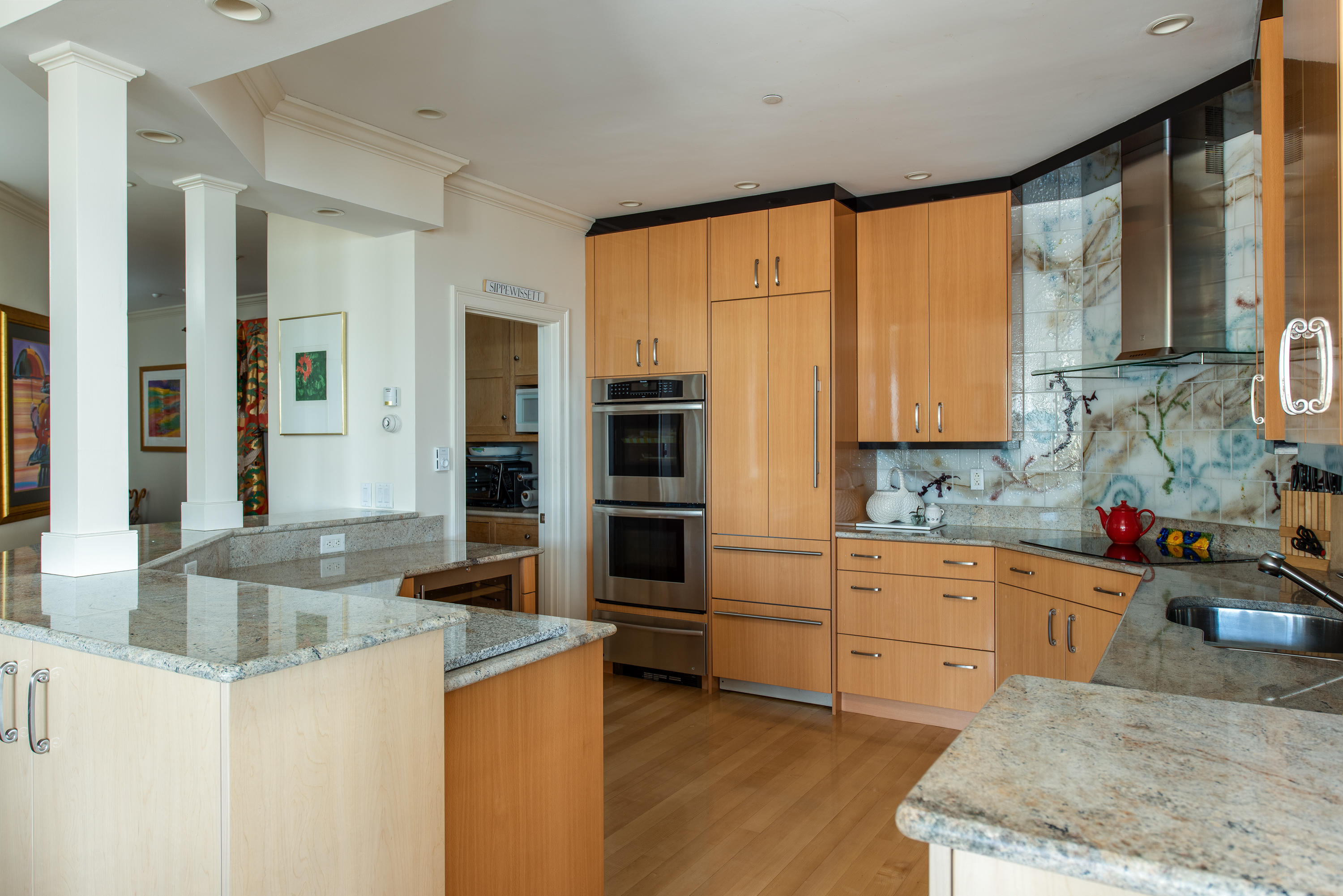 28 Cape Codder Road, Unit 109BU Falmouth, MA 02540 - Photo 12 of 20 a kitchen with stainless steel appliances granite countertop a sink and cabinets