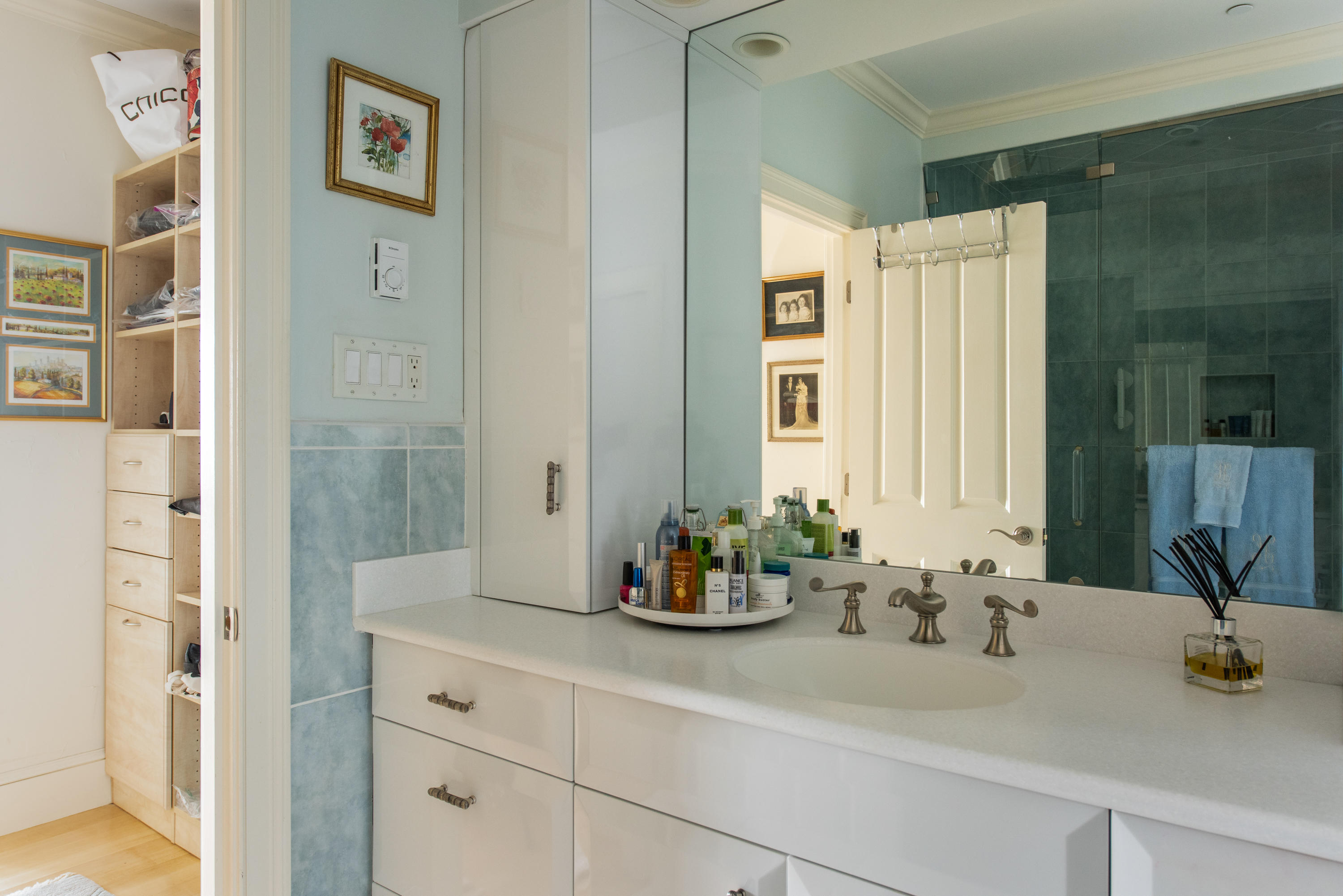 28 Cape Codder Road, Unit 109BU Falmouth, MA 02540 - Photo 16 of 20 a bathroom with a sink a potted plant and a shower