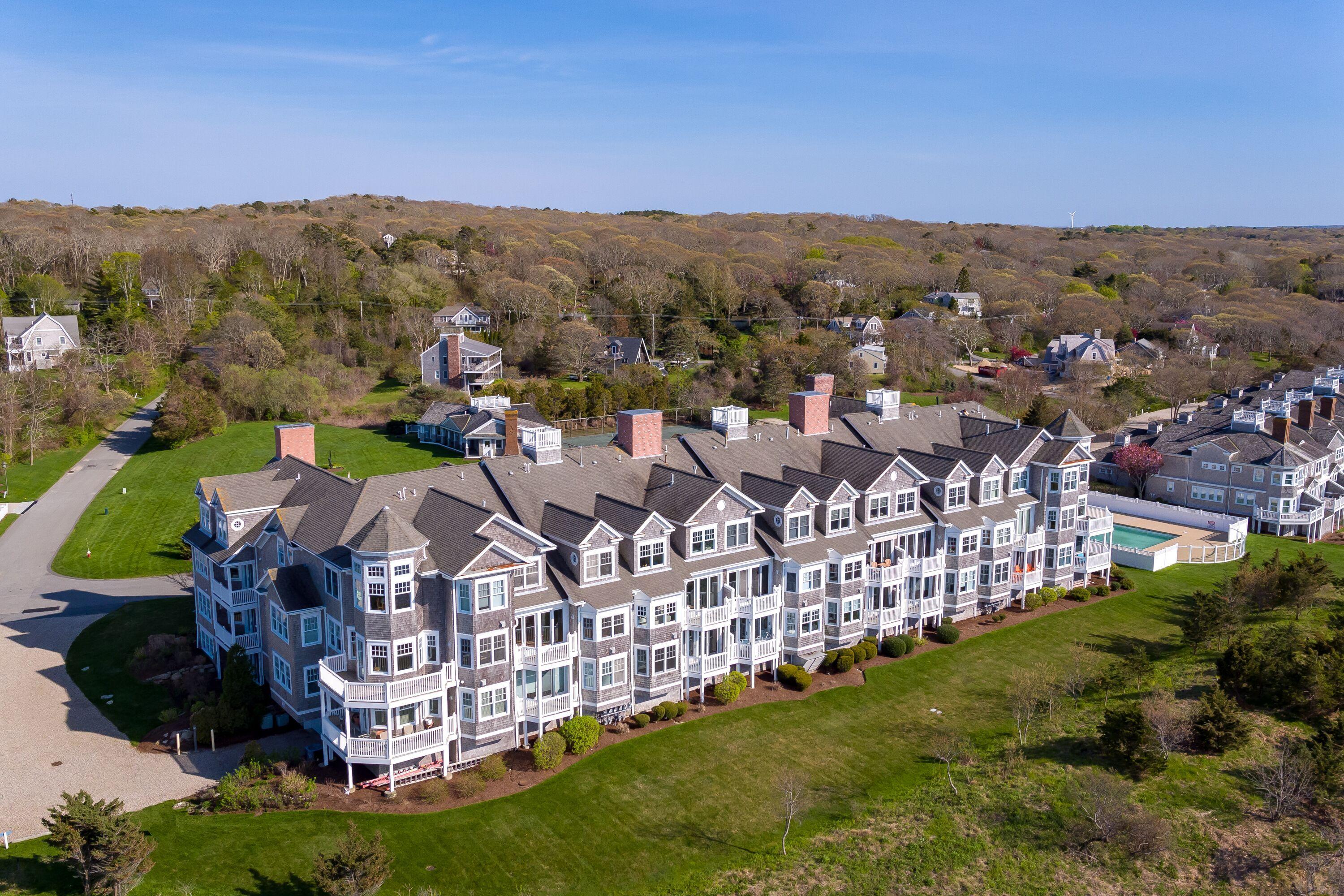28 Cape Codder Road, Unit 109BU Falmouth, MA 02540 - Photo 18 of 20 a view of city with tall buildings
