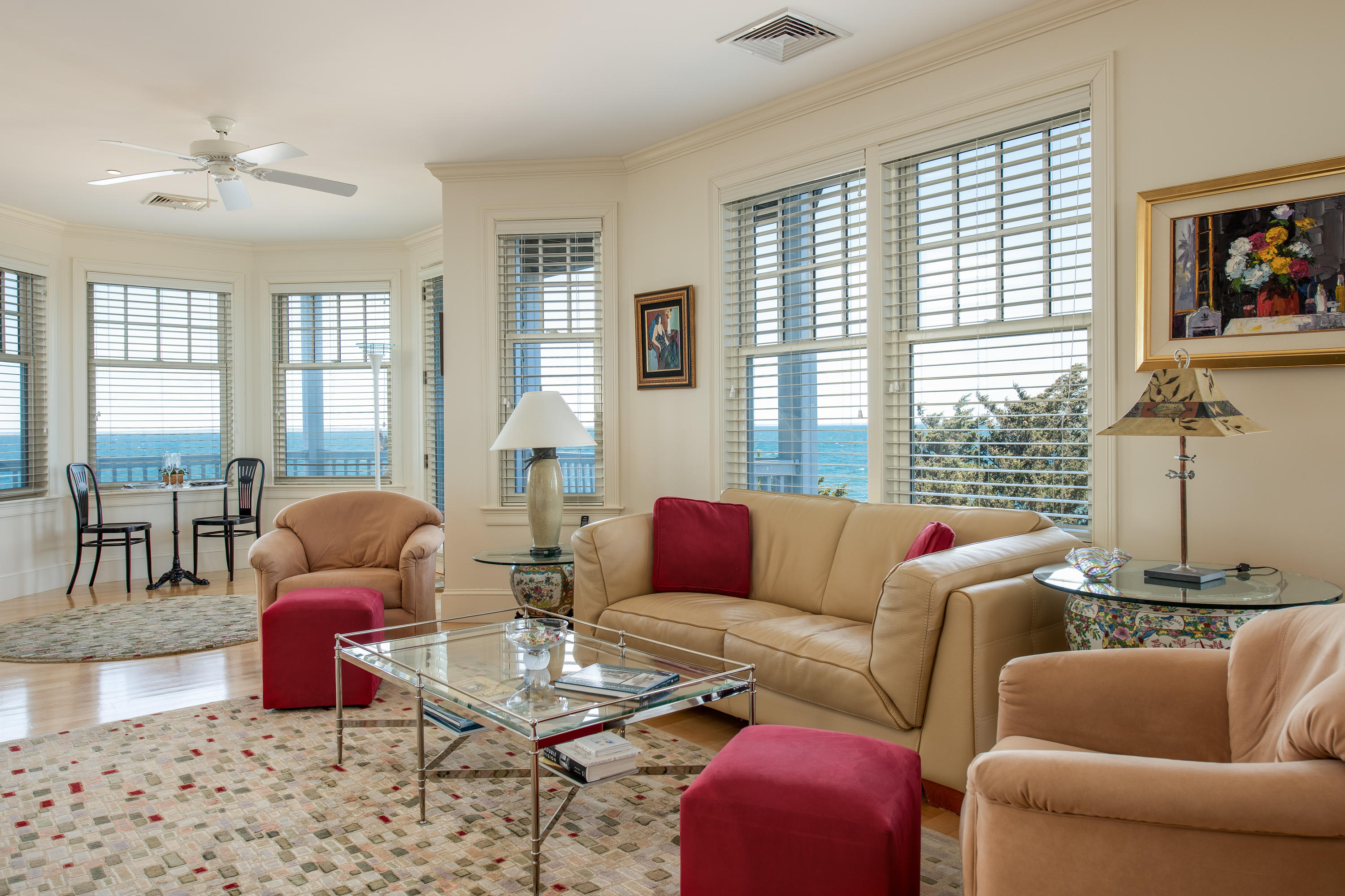 28 Cape Codder Road, Unit 109BU Falmouth, MA 02540 - Photo 6 of 20 a living room with furniture and large windows