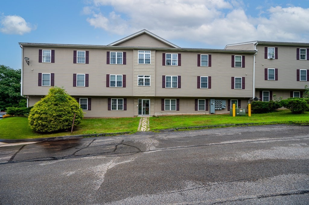1 Hatfield Street, Unit 3 Worcester, MA 01604 - Photo 1 of 23 a front view of a house with a yard and a garage