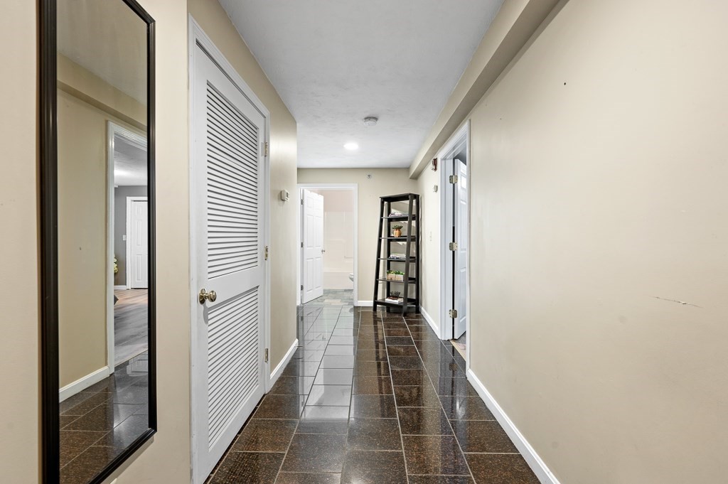 1 Hatfield Street, Unit 3 Worcester, MA 01604 - Photo 12 of 23 a view of hallway with stairs and a window