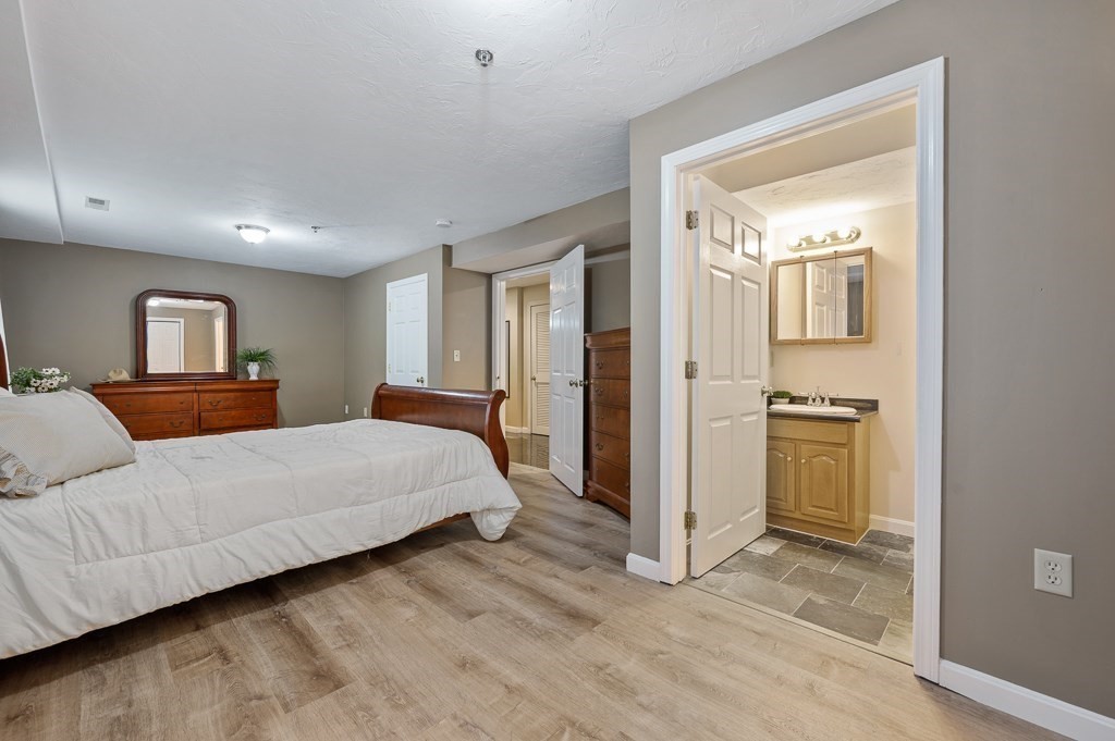 1 Hatfield Street, Unit 3 Worcester, MA 01604 - Photo 15 of 23 a bedroom with a bed and a view of bathroom