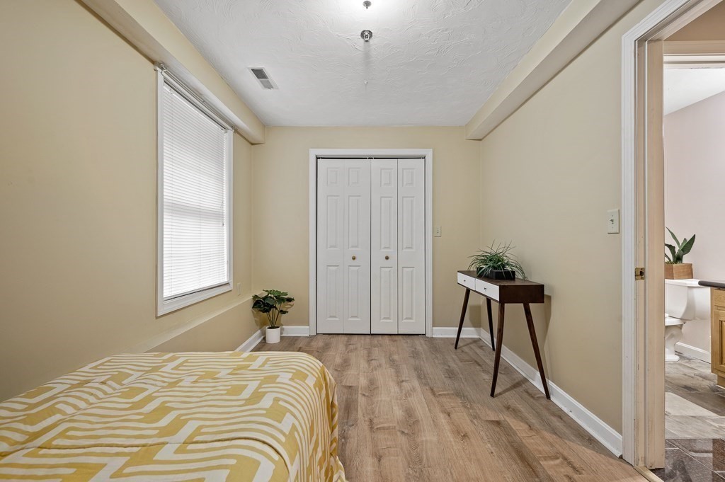 1 Hatfield Street, Unit 3 Worcester, MA 01604 - Photo 19 of 23 a bedroom with a bed and a window