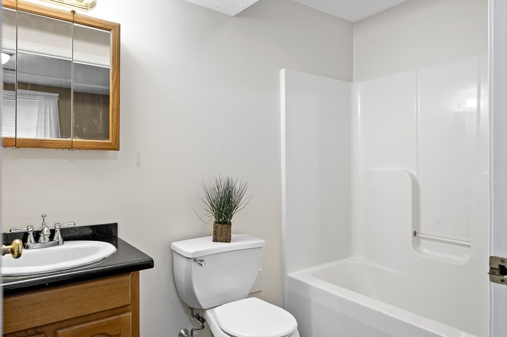 1 Hatfield Street, Unit 3 Worcester, MA 01604 - Photo 21 of 23 a bathroom with a toilet a sink and a bathtub