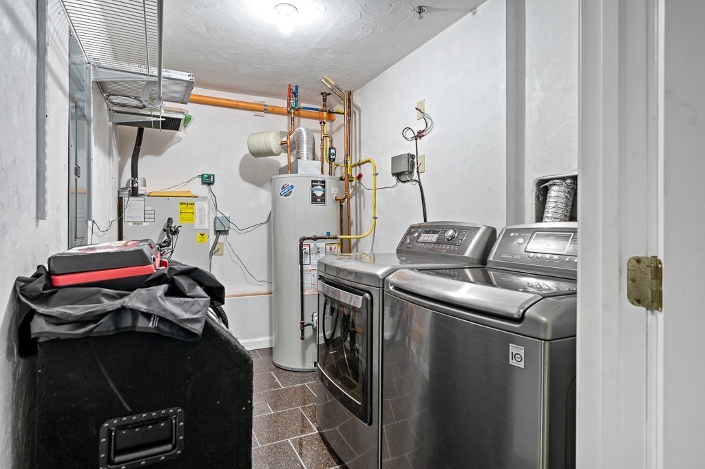1 Hatfield Street, Unit 3 Worcester, MA 01604 - Photo 22 of 23 a view of walk in closet with clothes and shoes