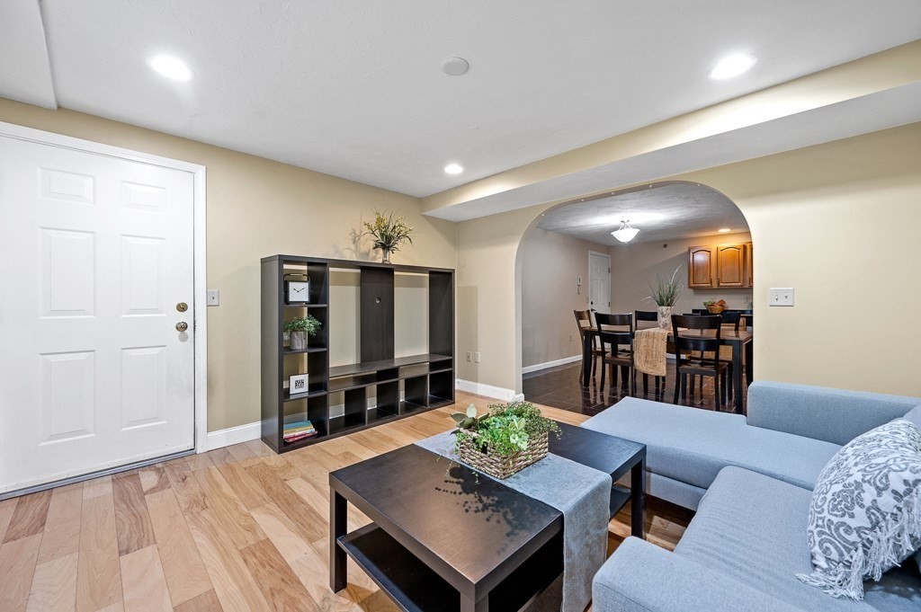 1 Hatfield Street, Unit 3 Worcester, MA 01604 - Photo 4 of 23 a living room with furniture and a wooden floor