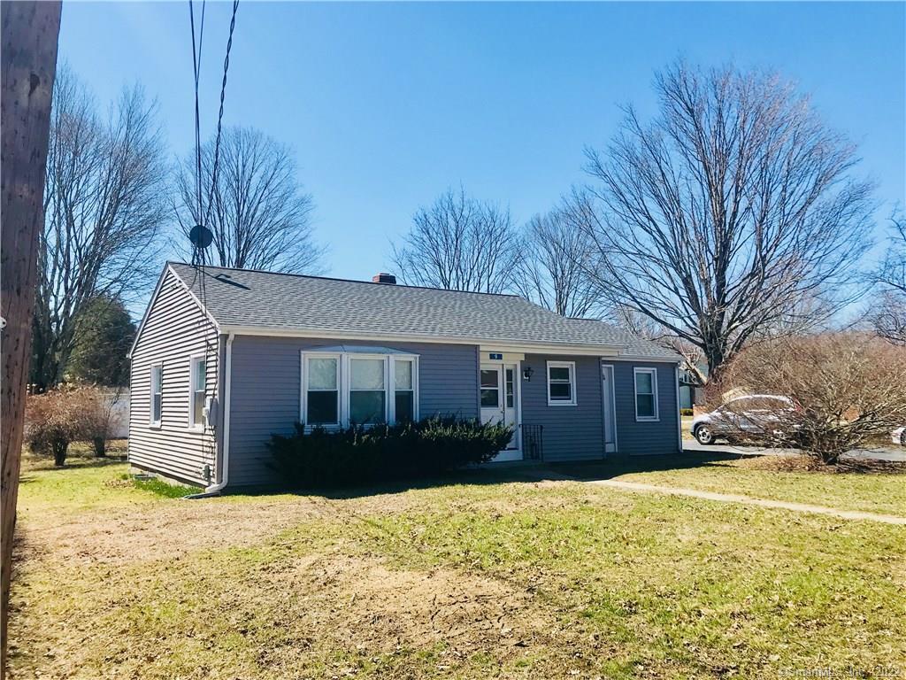 9 Jr Avenue Killingly, CT 06239 - Photo 1 of 1 a front view of house with yard and trees around