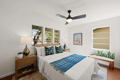 a bedroom with a bed and a window