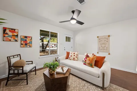 a living room with furniture and a large window