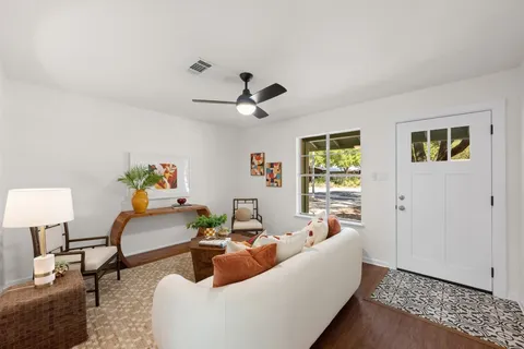 a living room with furniture and a window