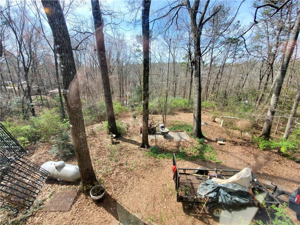 392 Beaver Ridge Road Jasper, GA 30143 - Photo 20 of 55 a view of a backyard with sitting area