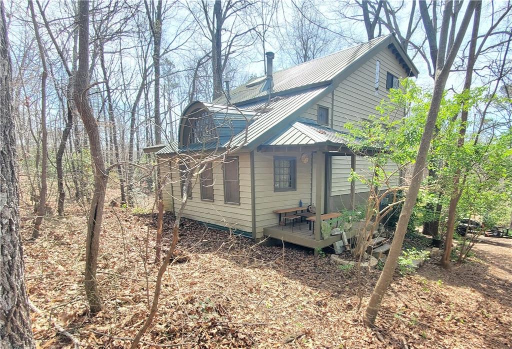 392 Beaver Ridge Road Jasper, GA 30143 - Photo 22 of 55 a view of a house with a yard and sitting area