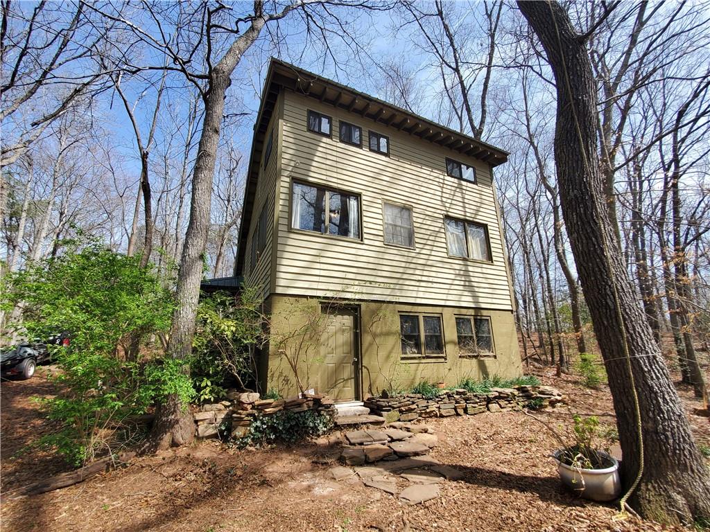 392 Beaver Ridge Road Jasper, GA 30143 - Photo 24 of 55 a front view of a house with a yard