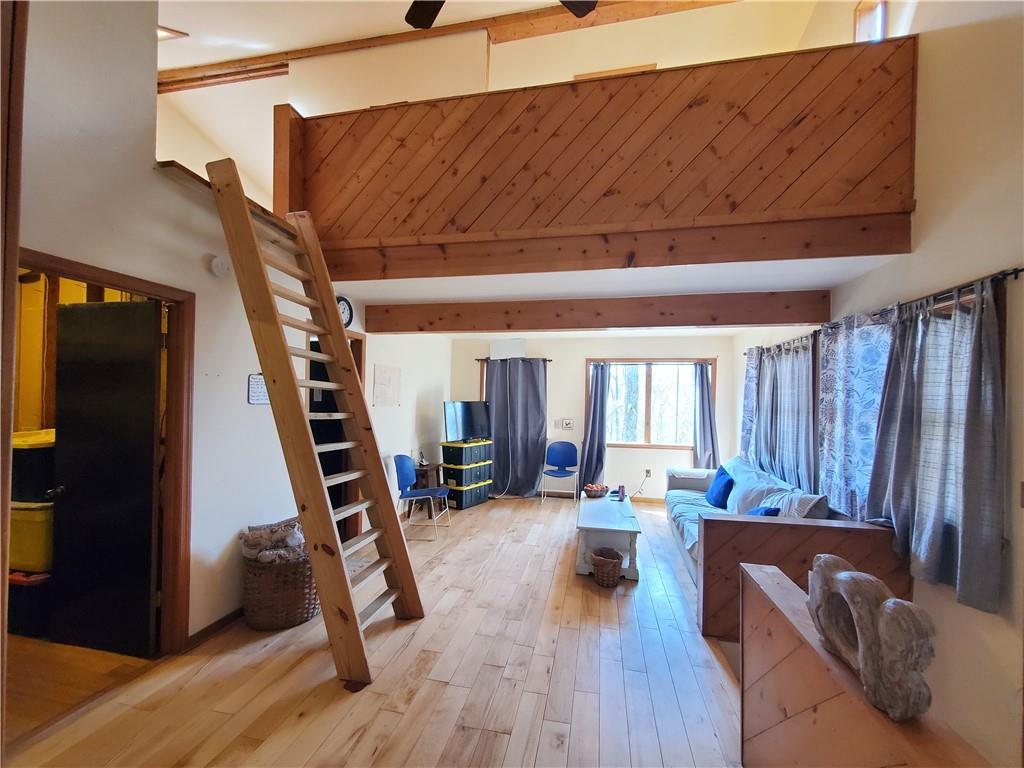 392 Beaver Ridge Road Jasper, GA 30143 - Photo 3 of 55 a living room with furniture and a wooden floor