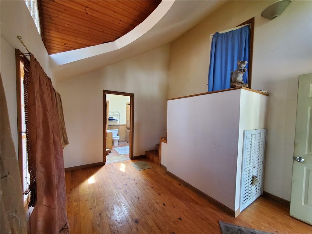 392 Beaver Ridge Road Jasper, GA 30143 - Photo 4 of 55 a view of an empty room with wooden floor and a window