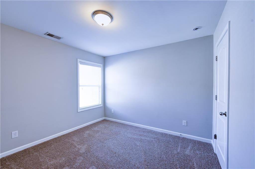 1226 Fischer Trace Cumming, GA 30041 - Photo 20 of 24 an empty room with a window
