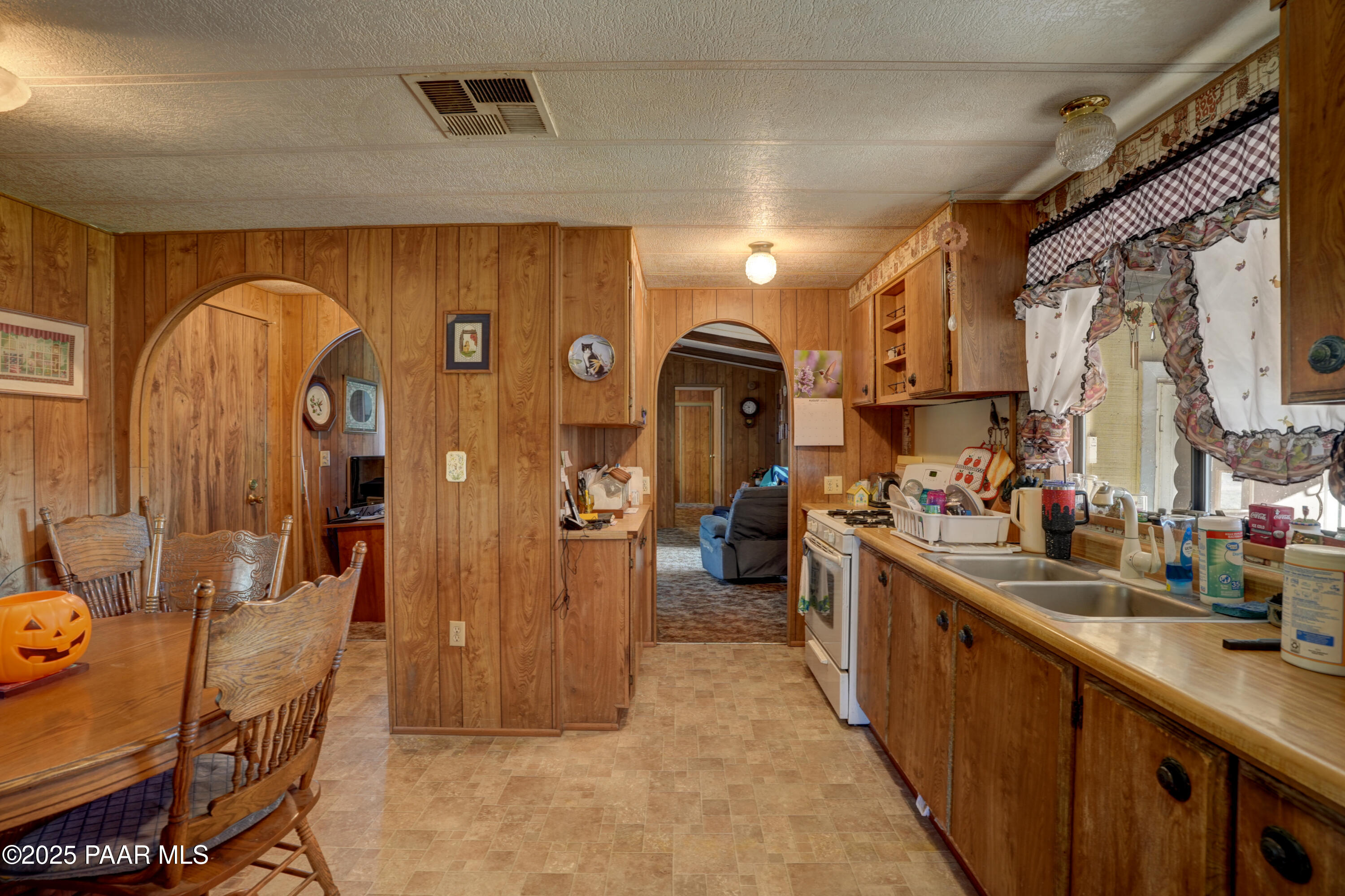 24025 North State Route 89 Paulden, AZ 86334 - Photo 13 of 29 a kitchen with stainless steel appliances a sink and cabinets