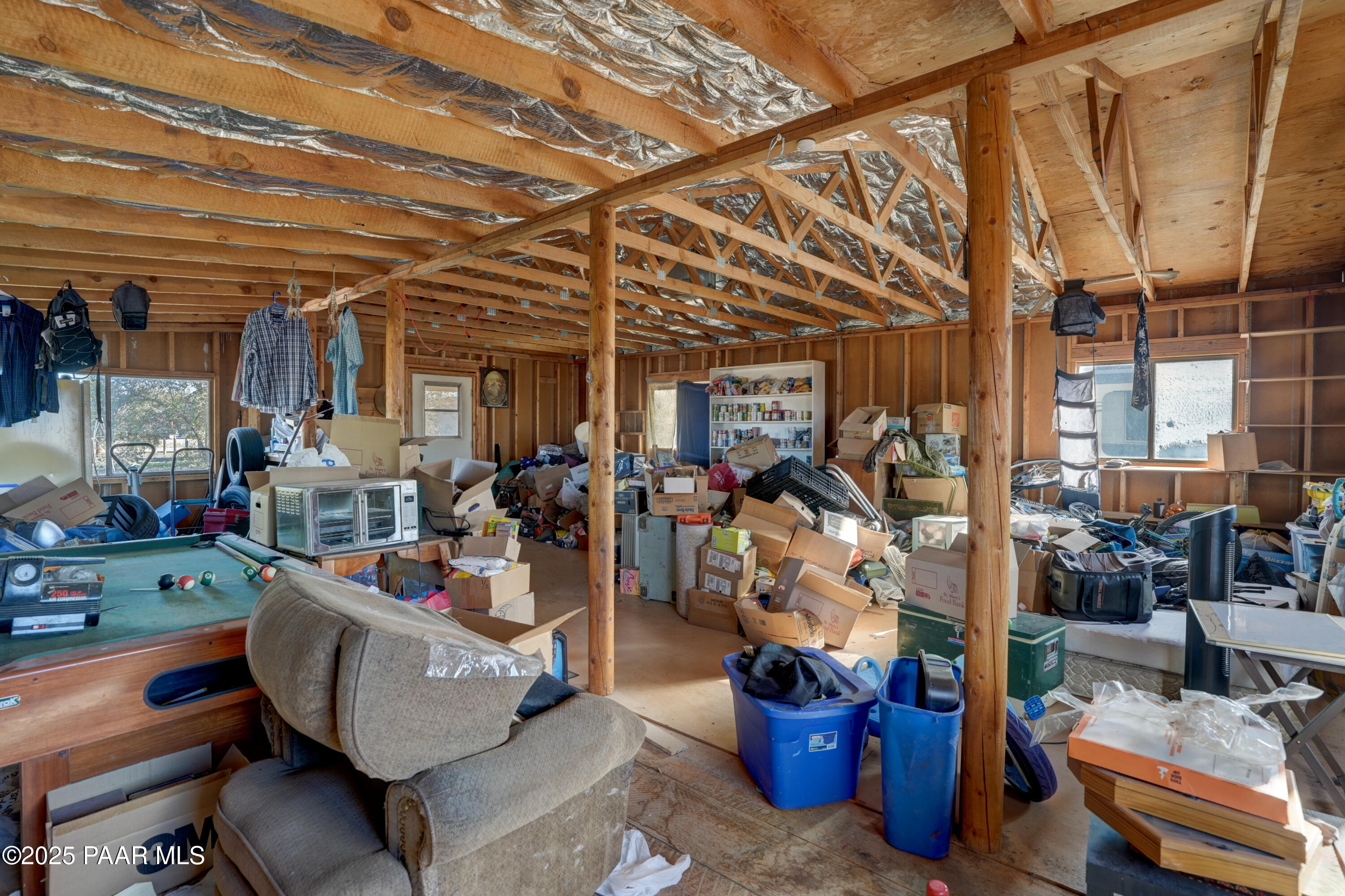 24025 North State Route 89 Paulden, AZ 86334 - Photo 20 of 29 a living room with lots of furniture and clutter