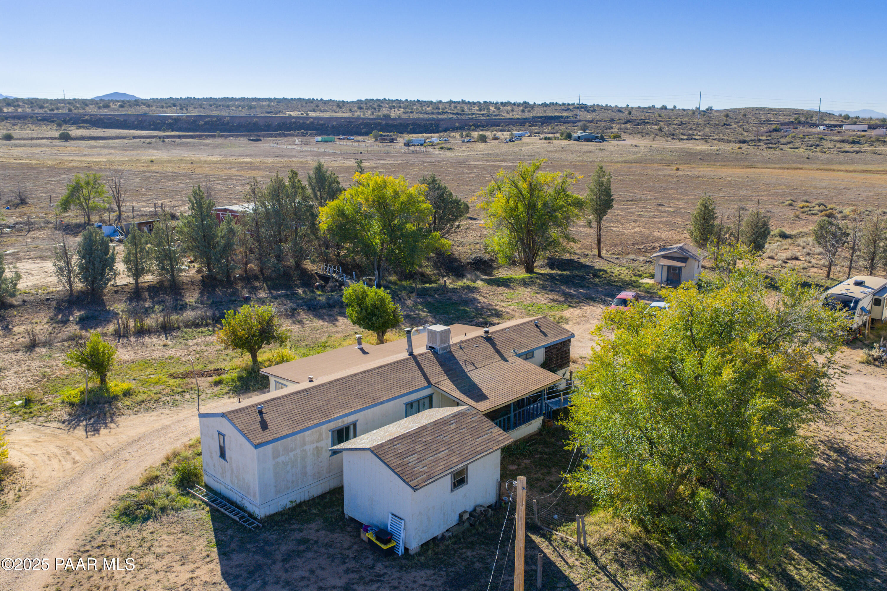 24025 North State Route 89 Paulden, AZ 86334 - Photo 2 of 29 a view of a lake with couches in front of house