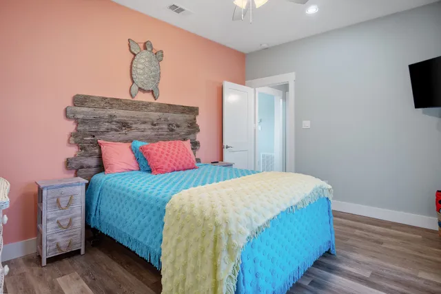 a bathroom with a granite countertop sink mirror vanity and toilet