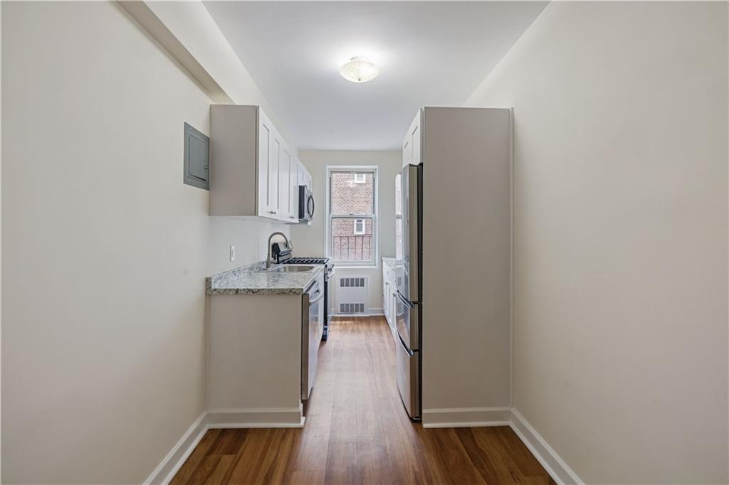 6801 Shore Road, Unit 4J Brooklyn, NY 11220 - Photo 6 of 15 a kitchen with a refrigerator and a sink