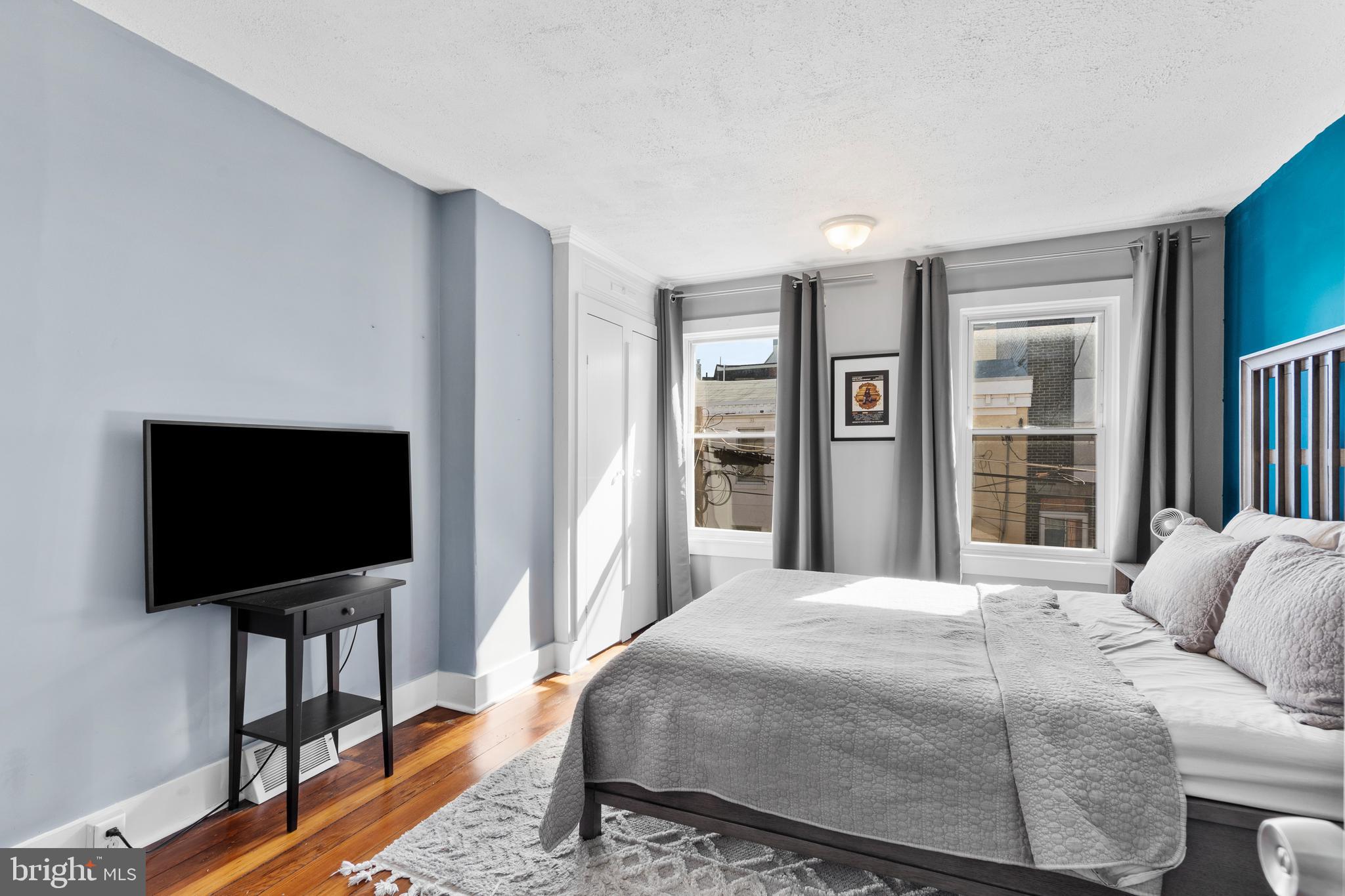 2564 Kern Street Philadelphia, PA 19125 - Photo 16 of 35 a bedroom with a bed and a flat screen tv