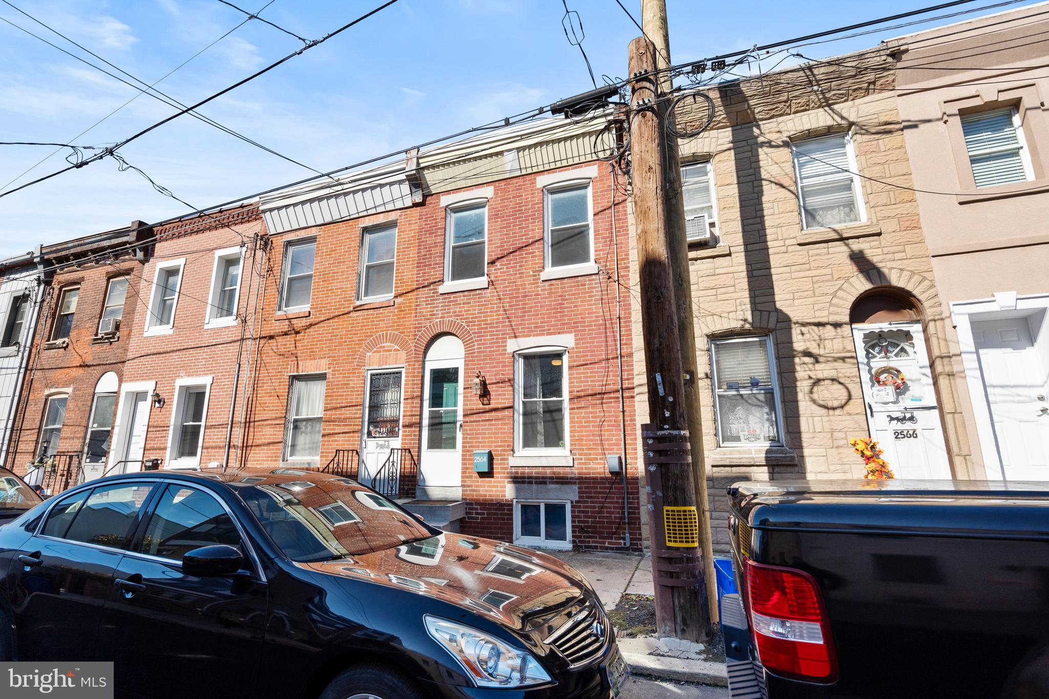 2564 Kern Street Philadelphia, PA 19125 - Photo 27 of 35 a front view of a building with multiple windows