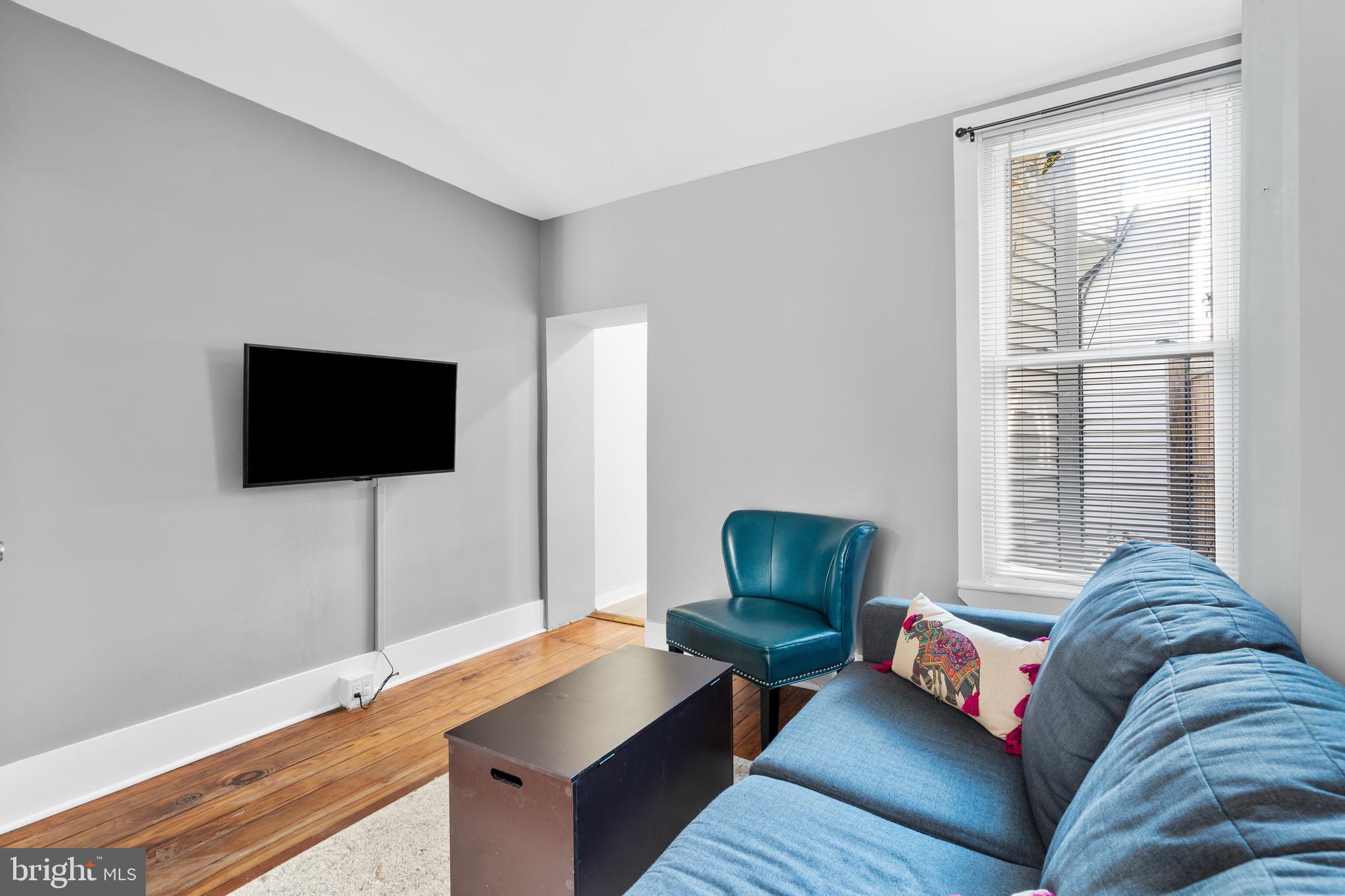 2564 Kern Street Philadelphia, PA 19125 - Photo 8 of 35 a living room with furniture and a flat screen tv