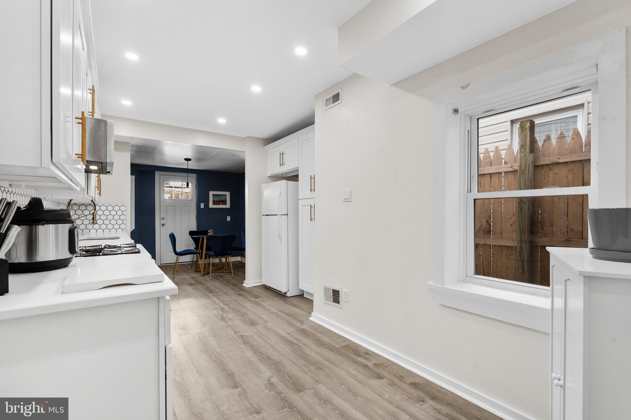 2564 Kern Street Philadelphia, PA 19125 - Photo 10 of 35 a kitchen with a sink a refrigerator and a stove