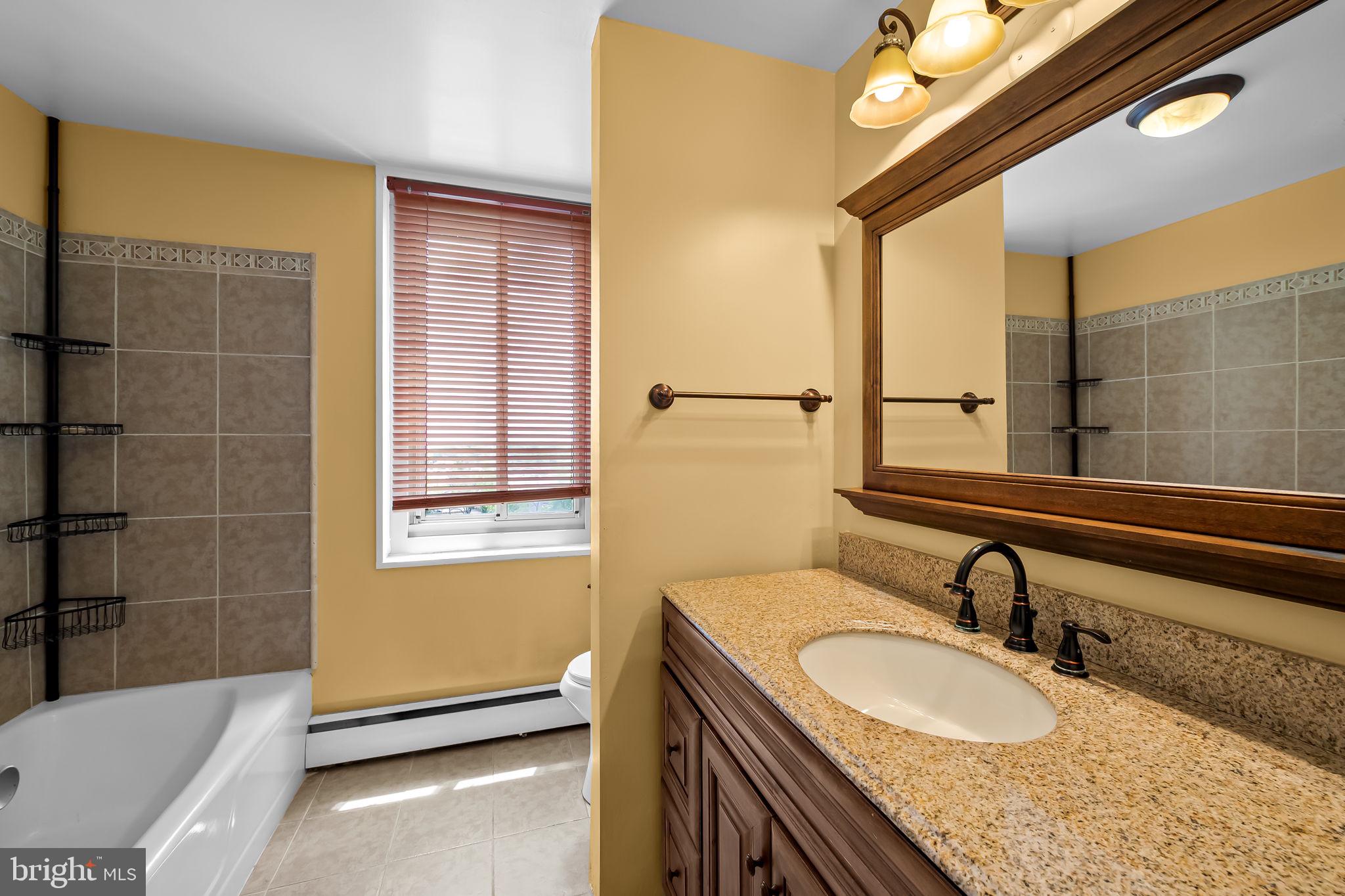 11 Slade Avenue, Unit 804 Baltimore, MD 21208 - Photo 24 of 37 hall bath with tub