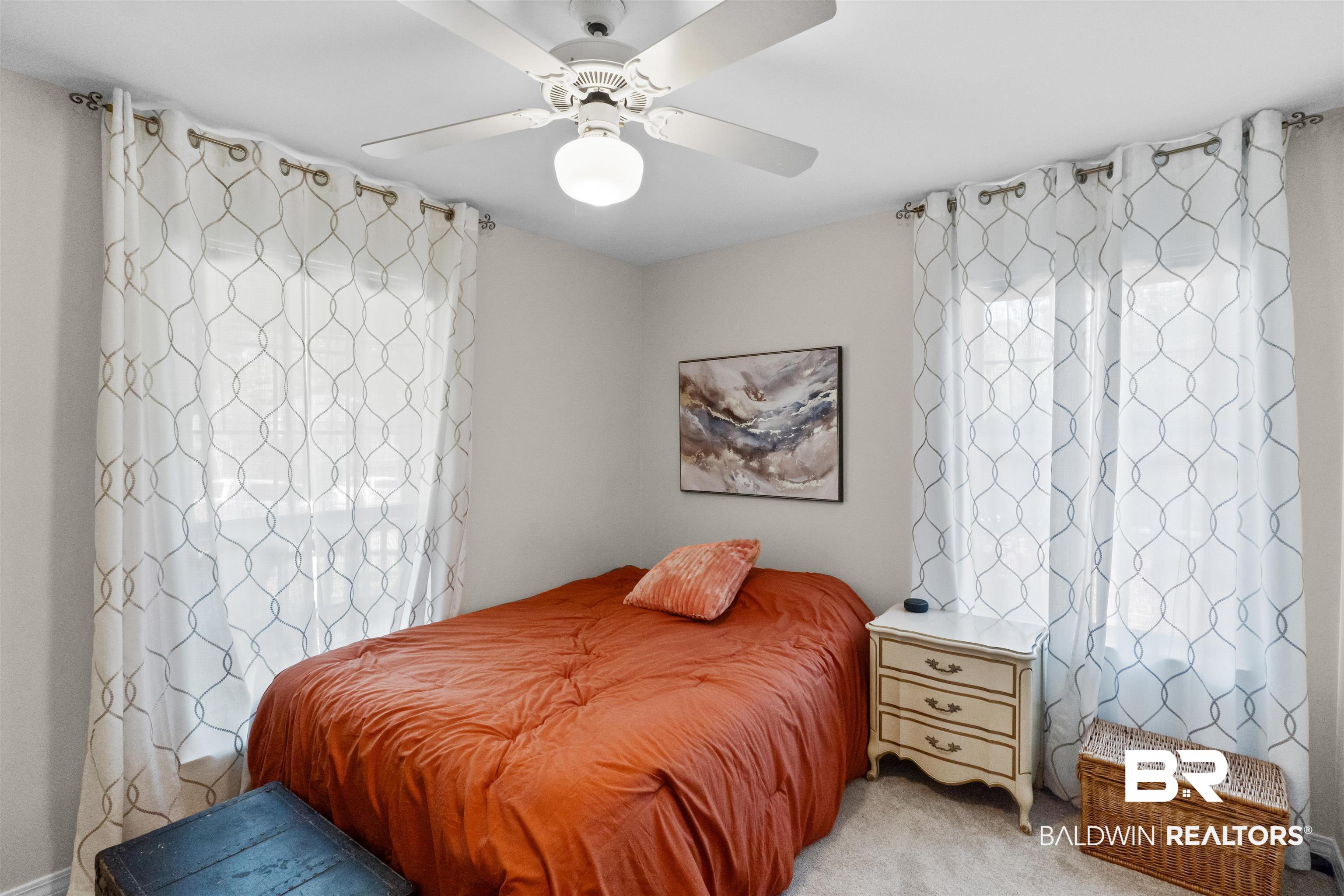 153 Lakeview Loop Daphne, AL 36526 - Photo 38 of 56 Filled with natural light, this secondary bedroom provides a welcoming space for family members, guests, or overnight visitors.