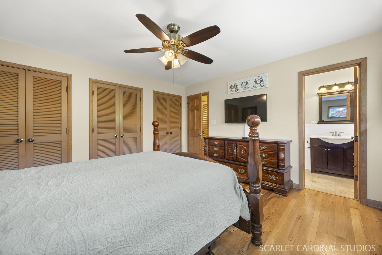 1007 Beau Brummel Drive Sleepy Hollow, IL 60118 - Photo 16 of 35 a bedroom with a bed and a chandelier