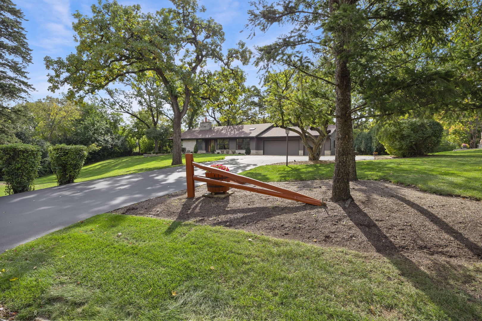 1007 Beau Brummel Drive Sleepy Hollow, IL 60118 - Photo 2 of 35 a view of a park with large trees