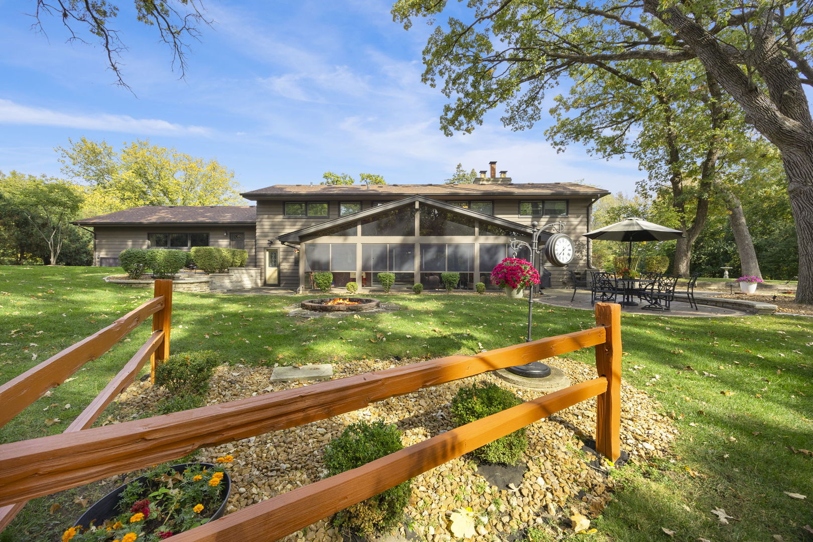 1007 Beau Brummel Drive Sleepy Hollow, IL 60118 - Photo 28 of 35 a view of a garden with wooden fence