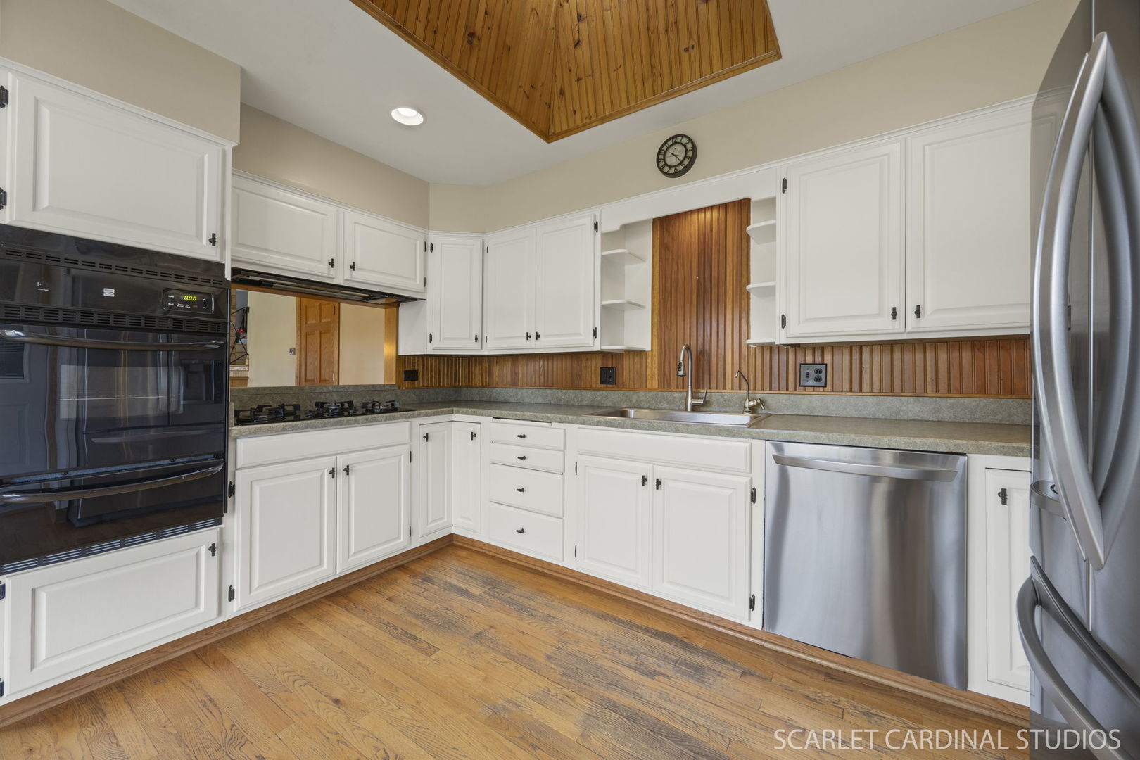 1007 Beau Brummel Drive Sleepy Hollow, IL 60118 - Photo 8 of 35 a kitchen with granite countertop white cabinets and white appliances