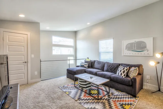 a living room with furniture and a couch